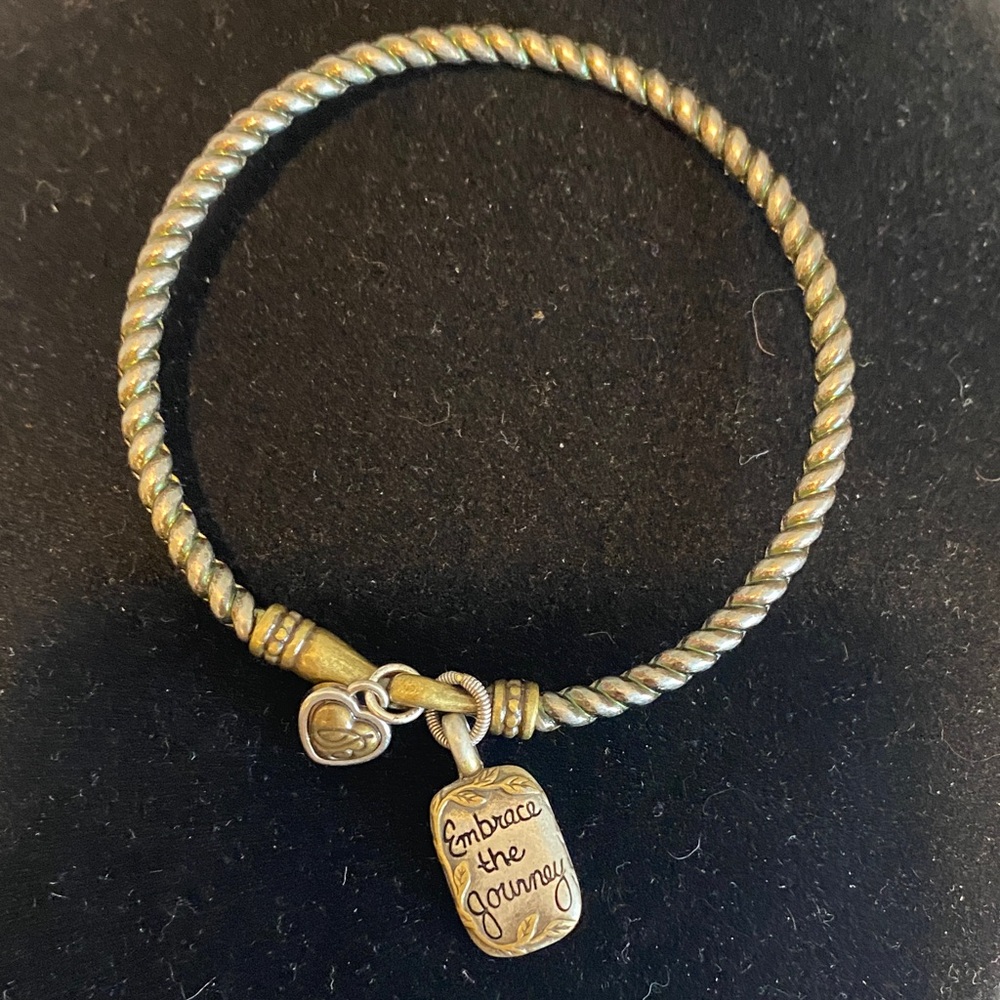 Brighton gold-tone twisted bangle bracelet with 'Embrace the Journey' charm